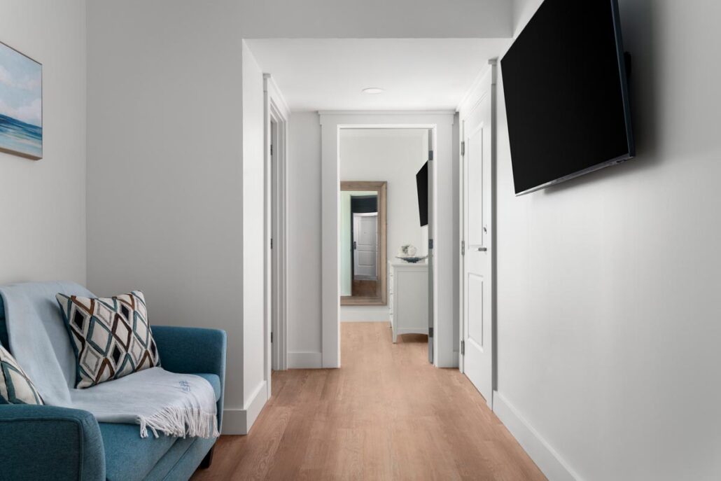 Hallway with sofa and TV