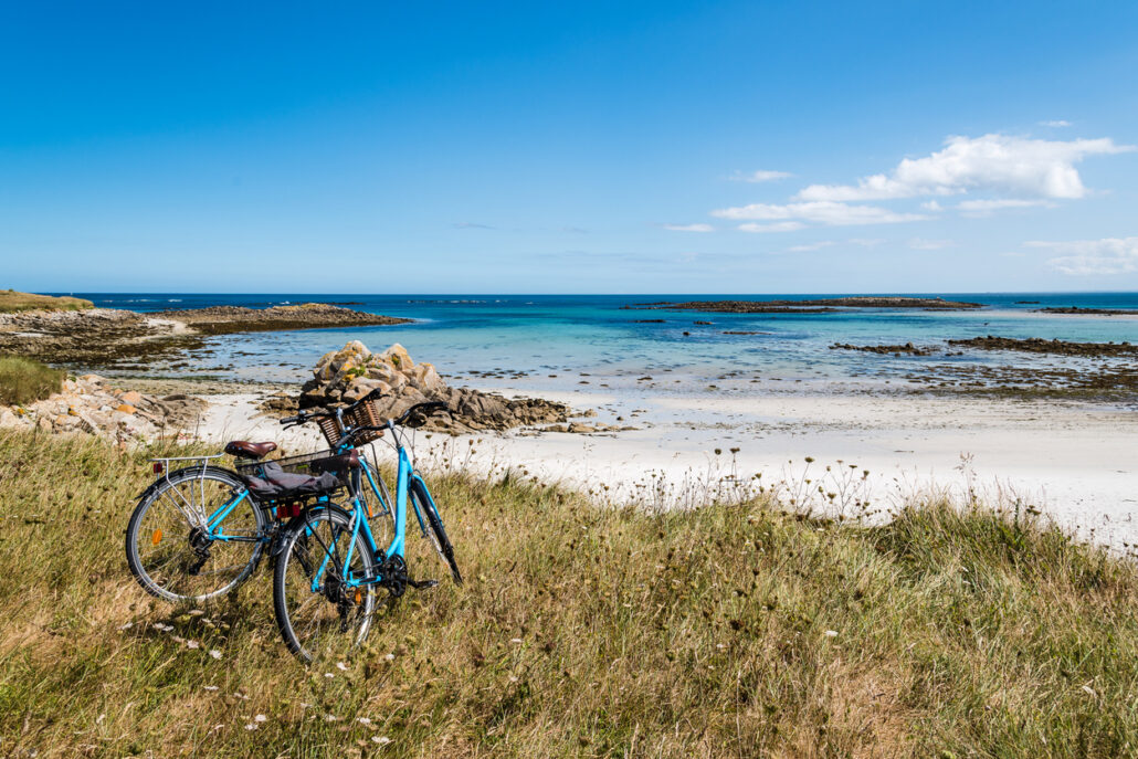 Bicycles parked against the beach with no people. Summer adventure