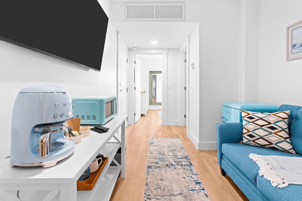 King bedroom with Sofa, smeg coffee maker, microwave, hallway