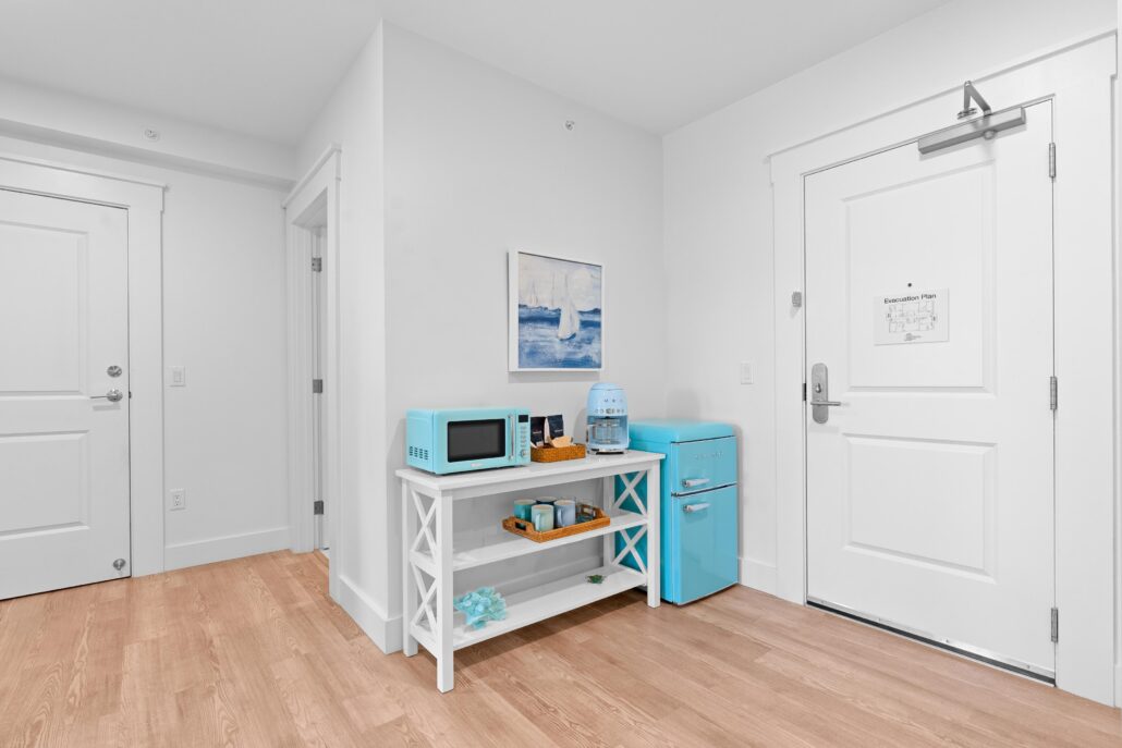 Living area with microwave, fridge.